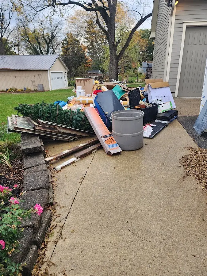 Dumpster being loaded with debris for 3 Yard Dumpster Rental in Greenbrier
